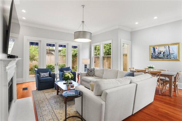 5934 Chestnut St, New Orleans, LA 70118 - living room with wood finished floors, recessed lighting, ornamental molding, and baseboards