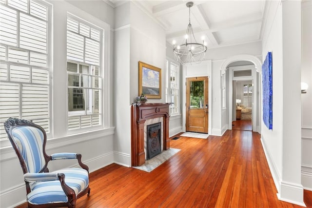 5934 Chestnut St, New Orleans, LA 70118 - foyer entrance featuring coffered ceiling, a chandelier, hardwood / wood-style floors, baseboards, and beam ceiling