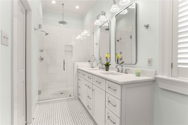 5934 Chestnut St, New Orleans, LA 70118 - full bathroom featuring double vanity, tile patterned floors, a stall shower, and a sink