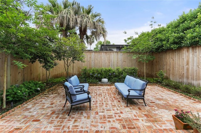 5934 Chestnut St, New Orleans, LA 70118 - view of patio with an outdoor living space and a fenced backyard