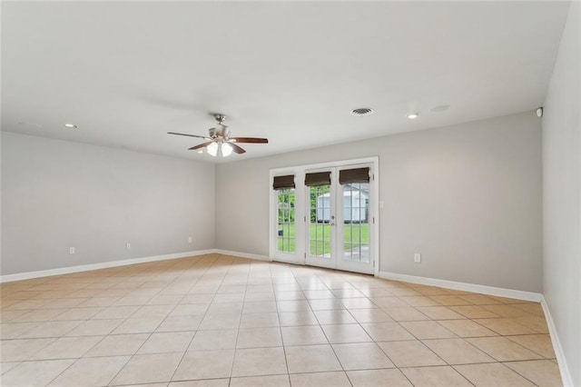 empty room featuring recessed lighting, light tile patterned flooring, a ceiling fan, visible vents, and baseboards