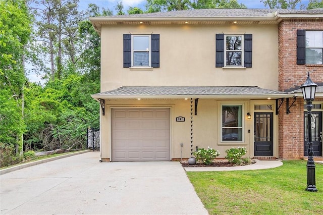 view of front of property featuring driveway, an attached garage, stucco siding, brick siding, and a front lawn
