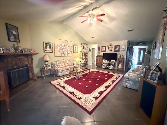 2053 Saulet Pl, Harvey, LA 70058 - living room with a ceiling fan, dark tile patterned floors, and a stone fireplace