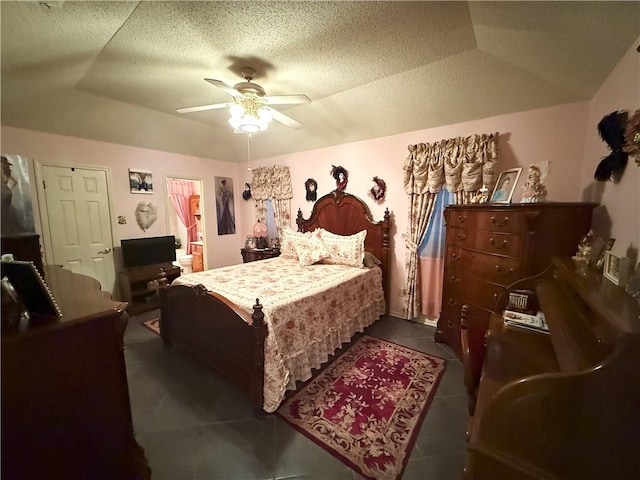 2053 Saulet Pl, Harvey, LA 70058 - bedroom featuring dark tile patterned floors, ceiling fan, and a textured ceiling