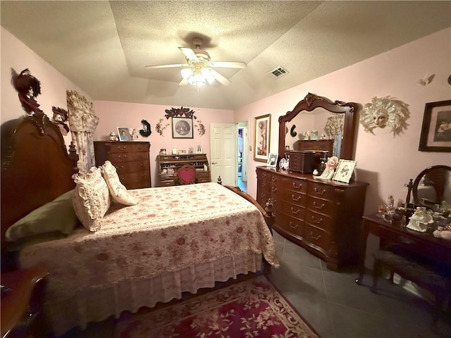 2053 Saulet Pl, Harvey, LA 70058 - bedroom with tile patterned floors, ceiling fan, and a textured ceiling