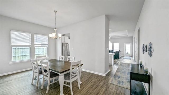 5520 Wake Reserve Rd, Slidell, LA 70461 - dining room with dark wood-style floors, baseboards, and a chandelier