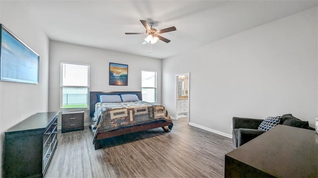 5520 Wake Reserve Rd, Slidell, LA 70461 - bedroom with a ceiling fan, baseboards, wood finished floors, and ensuite bath