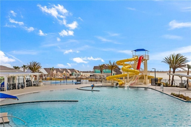 5520 Wake Reserve Rd, Slidell, LA 70461 - community pool with fence, a water slide, and a water play area