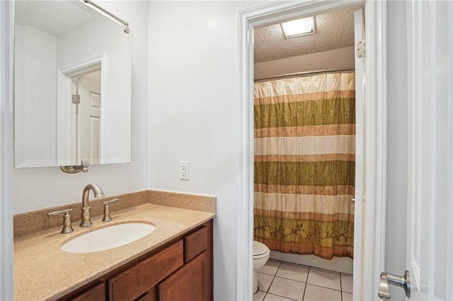 622 Pennsylvania Ave, Slidell, LA 70458 - bathroom with tile patterned floors, toilet, a textured ceiling, and vanity