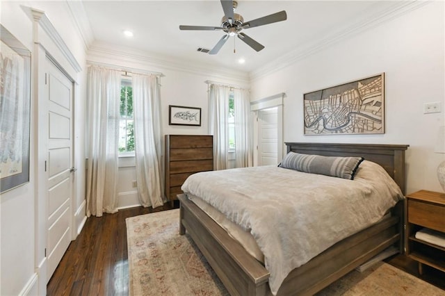 616 Cadiz St, New Orleans, LA 70115 - bedroom featuring dark wood-type flooring, visible vents, ornamental molding, and multiple windows