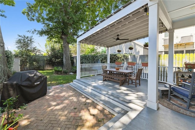 616 Cadiz St, New Orleans, LA 70115 - view of patio featuring outdoor dining space, area for grilling, and a fenced backyard