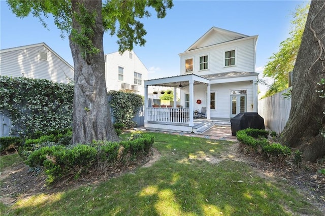 616 Cadiz St, New Orleans, LA 70115 - rear view of property featuring fence and a yard