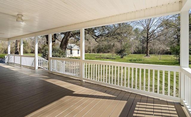 wooden deck with a yard