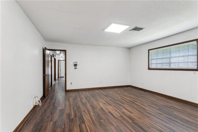 194 Sedgefield Dr, Harahan, LA 70123 - spare room featuring dark wood-type flooring and baseboards