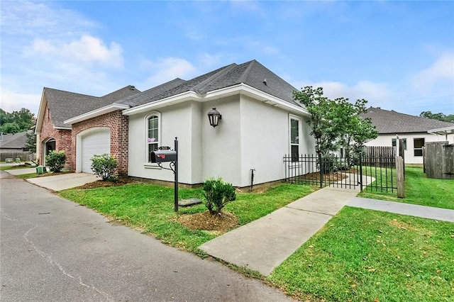 view of side of property with a garage, a lawn, roof with shingles, stucco siding, and fence