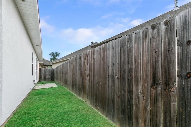 view of yard featuring a fenced backyard