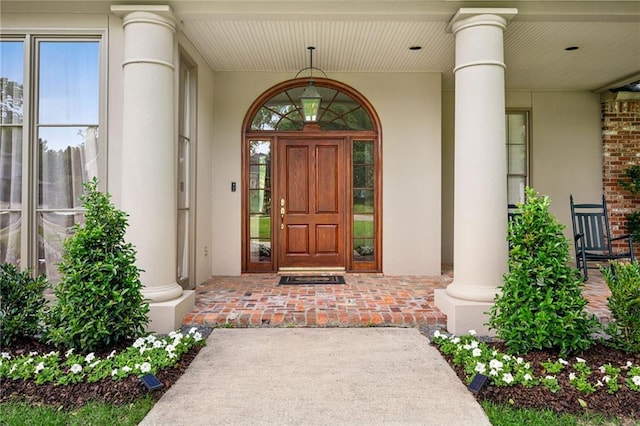 454 Rutherford Dr, Covington, LA 70433 - doorway to property with a porch and stucco siding