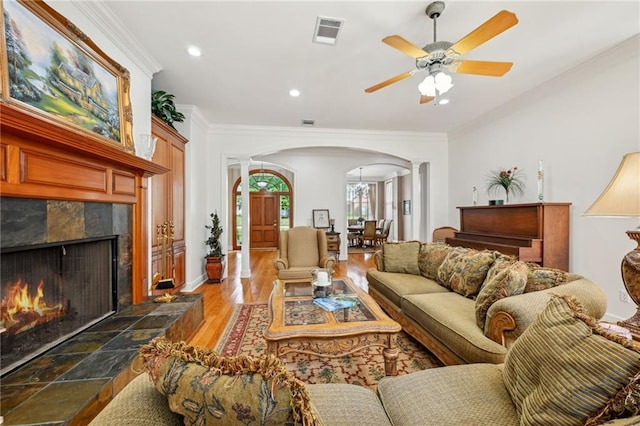 454 Rutherford Dr, Covington, LA 70433 - living area with recessed lighting, arched walkways, visible vents, and a ceiling fan