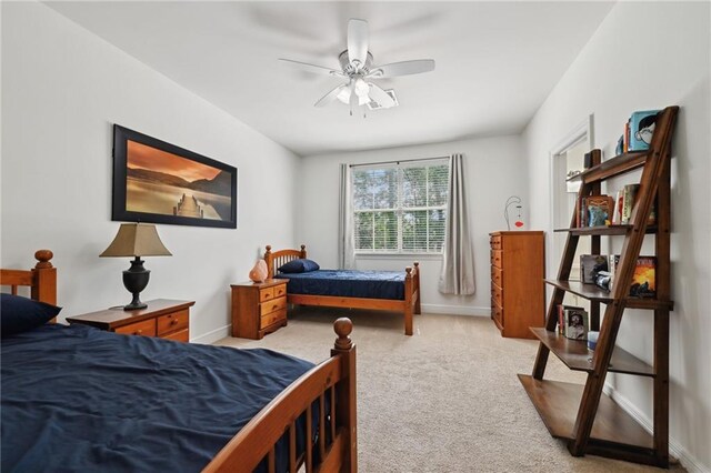 454 Rutherford Dr, Covington, LA 70433 - bedroom featuring baseboards, a ceiling fan, and light colored carpet