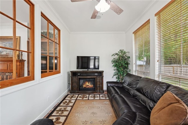 454 Rutherford Dr, Covington, LA 70433 - living area with ceiling fan, a glass covered fireplace, crown molding, baseboards, and wood finished floors