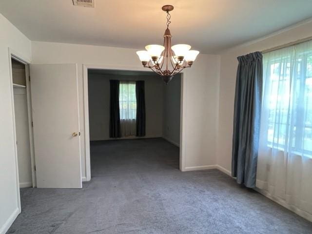 1736 11th St, Slidell, LA 70458 - carpeted spare room featuring a chandelier and baseboards