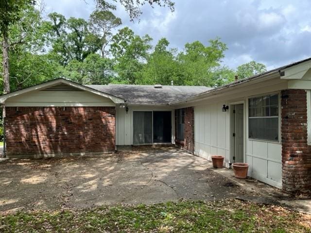 1736 11th St, Slidell, LA 70458 - view of property exterior featuring brick siding and an attached garage
