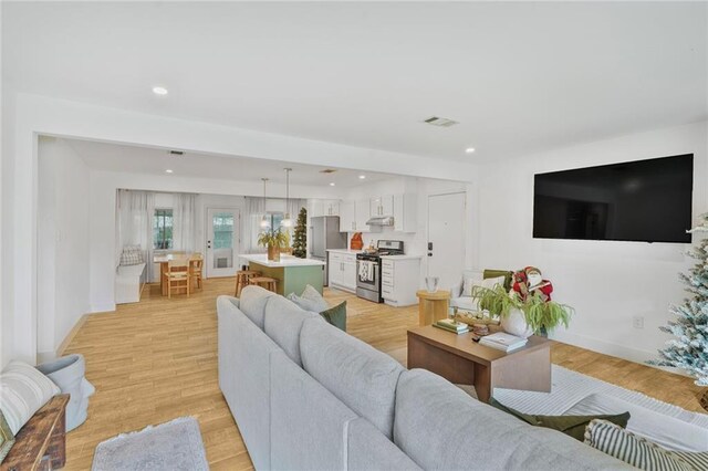 117 Diane Ave, River Ridge, LA 70123 - living room featuring light wood-type flooring, recessed lighting, and baseboards