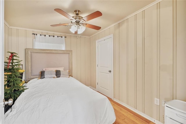 117 Diane Ave, River Ridge, LA 70123 - bedroom with light wood finished floors, crown molding, a ceiling fan, and a decorative wall