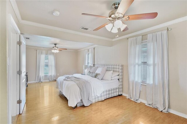 117 Diane Ave, River Ridge, LA 70123 - bedroom with light wood-style flooring, baseboards, ornamental molding, and a ceiling fan