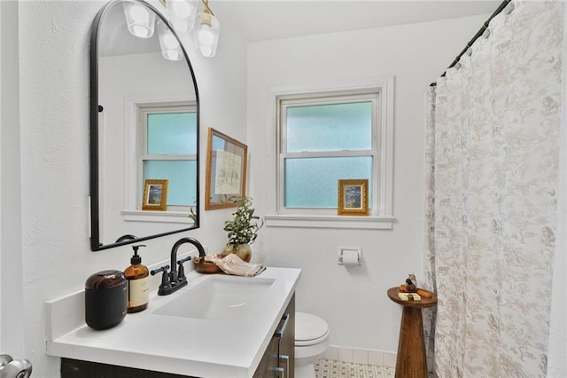 117 Diane Ave, River Ridge, LA 70123 - full bathroom featuring toilet, vanity, baseboards, and tile patterned flooring
