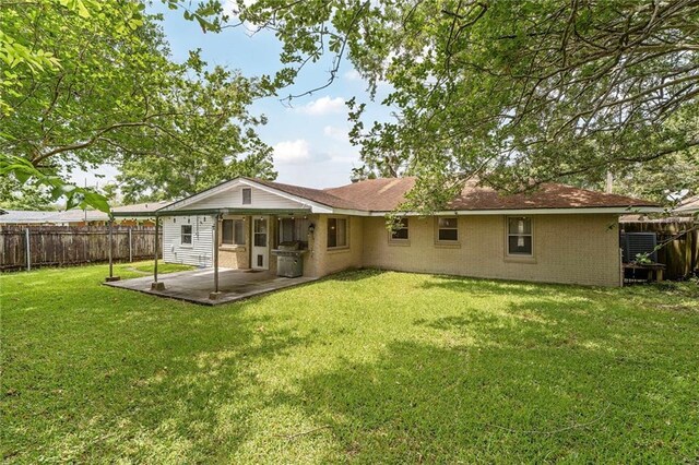 117 Diane Ave, River Ridge, LA 70123 - back of property with a patio area and brick siding