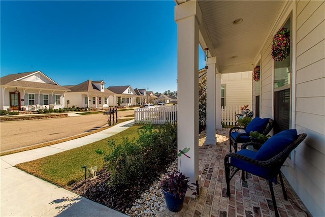 2329 Bradbury Pl, Covington, LA 70433 - view of patio featuring a residential view and covered porch
