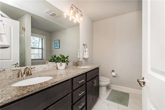 2329 Bradbury Pl, Covington, LA 70433 - bathroom featuring a sink, toilet, double vanity, and visible vents