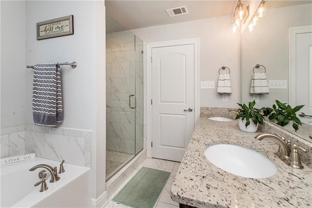 2329 Bradbury Pl, Covington, LA 70433 - full bathroom with visible vents, a sink, a garden tub, and a stall shower