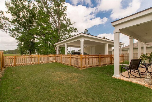2329 Bradbury Pl, Covington, LA 70433 - view of yard featuring a patio and a fenced backyard