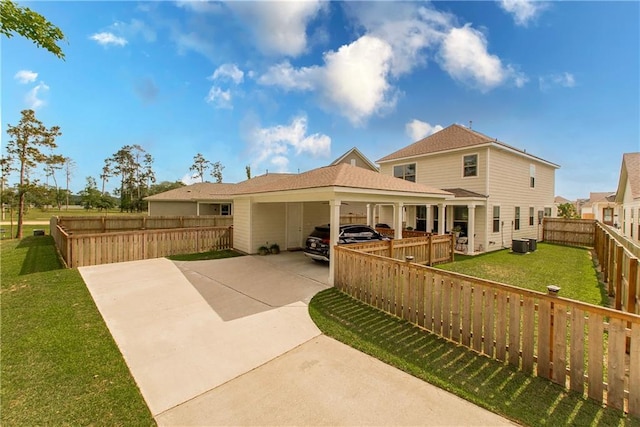 2329 Bradbury Pl, Covington, LA 70433 - rear view of house featuring concrete driveway, a yard, fence private yard, and central AC