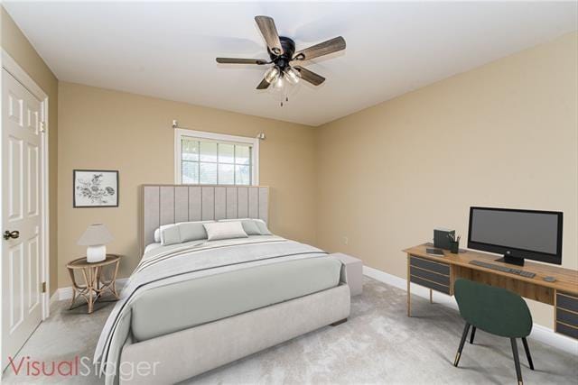 bedroom featuring baseboards, carpet floors, a ceiling fan, and a desk