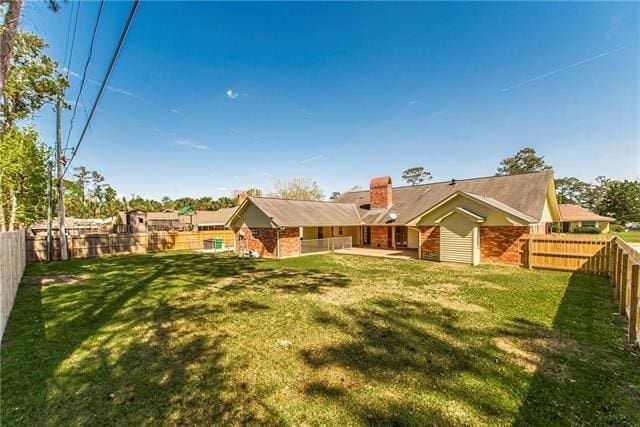 rear view of property with a chimney