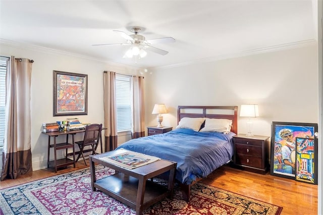 8416 Oak St Unit G, New Orleans, LA 70118 - bedroom with wood finished floors, ornamental molding, and a ceiling fan