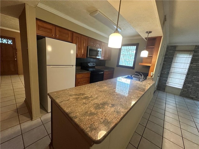 kitchen with stainless steel microwave, freestanding refrigerator, a sink, black range with electric stovetop, and crown molding