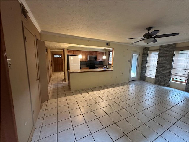 unfurnished living room featuring crown molding, a textured ceiling, and light tile patterned floors