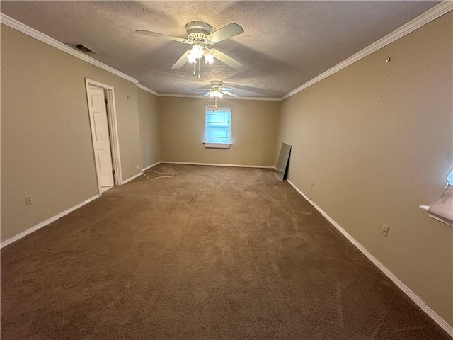 empty room featuring a textured ceiling, dark colored carpet, visible vents, ornamental molding, and a ceiling fan