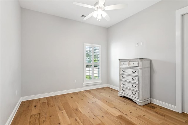 unfurnished bedroom with baseboards, visible vents, ceiling fan, and light wood finished floors