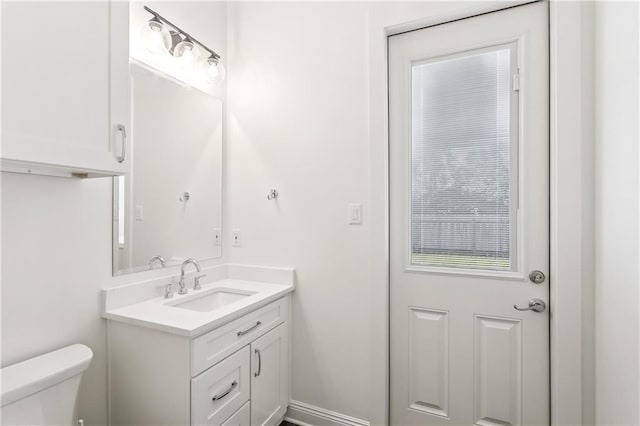 half bath with vanity and toilet