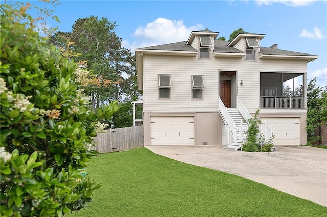 386 Marina Blvd, Mandeville, LA 70471 - raised beach house with a garage, driveway, a sunroom, stairs, and roof with shingles