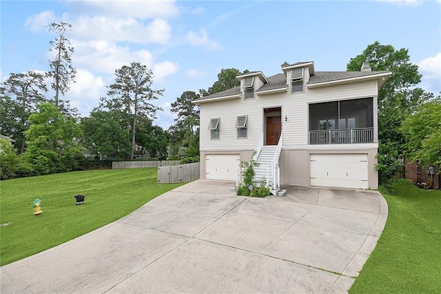 386 Marina Blvd, Mandeville, LA 70471 - view of front of property featuring a front yard, concrete driveway, stairs, and a garage