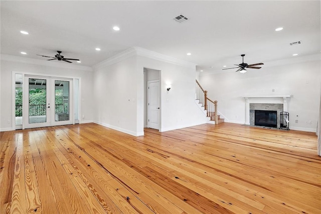386 Marina Blvd, Mandeville, LA 70471 - unfurnished living room featuring a ceiling fan, recessed lighting, crown molding, baseboards, and a fireplace