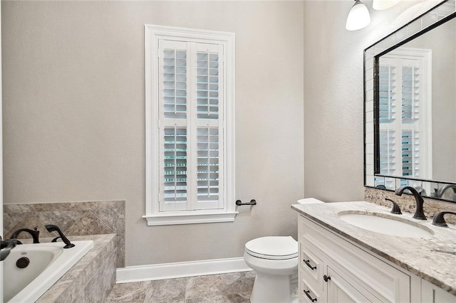 386 Marina Blvd, Mandeville, LA 70471 - bathroom featuring a bath, vanity, baseboards, and toilet