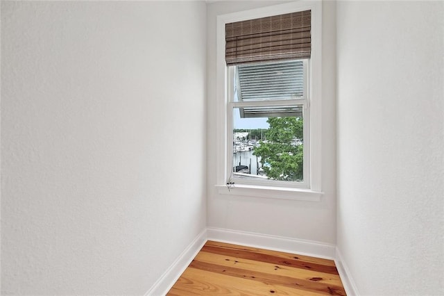 386 Marina Blvd, Mandeville, LA 70471 - spare room featuring baseboards and wood finished floors