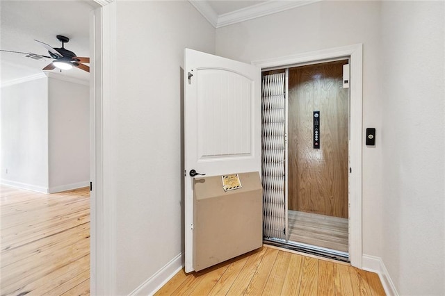 386 Marina Blvd, Mandeville, LA 70471 - doorway featuring crown molding, wood finished floors, ceiling fan, and baseboards